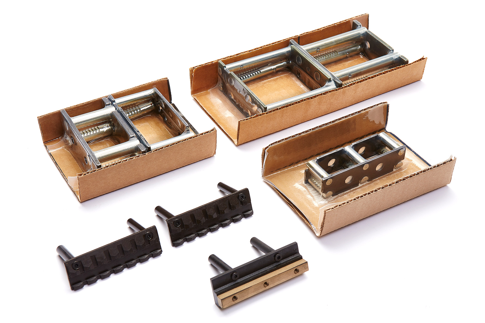 Supports de barres d'usure et de sabots de guidage